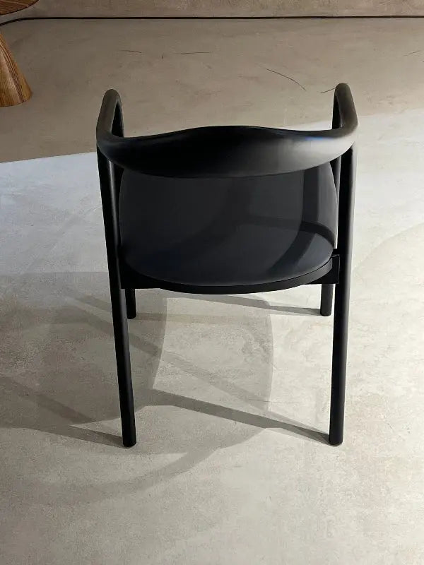 Black wooden chair with black fabric in a showroom