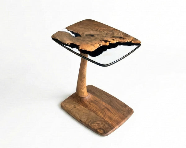 Wooden side table with a glass top on a white background