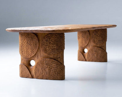 Wooden table with natural texture and circular cutouts on a gray background