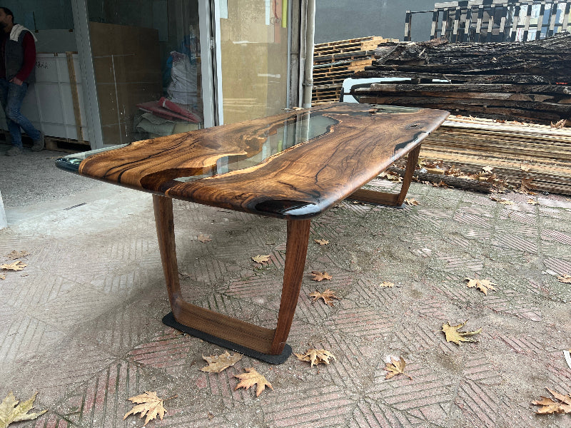 clear resin dining table with wooden leg