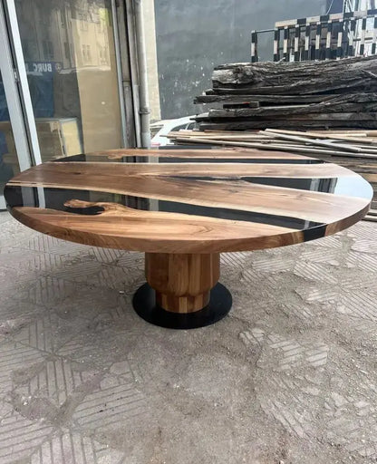 round epoxy resin dining table with wooden tulip base made of walnut